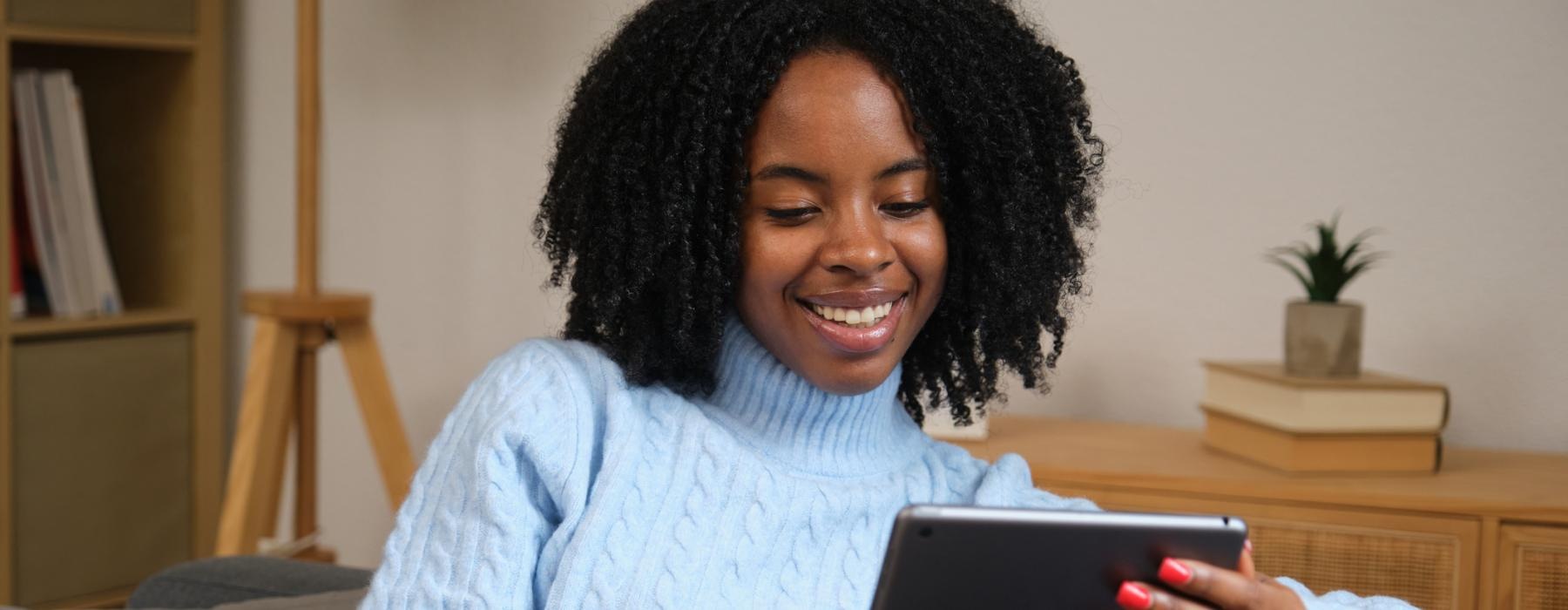 a woman holding a tablet