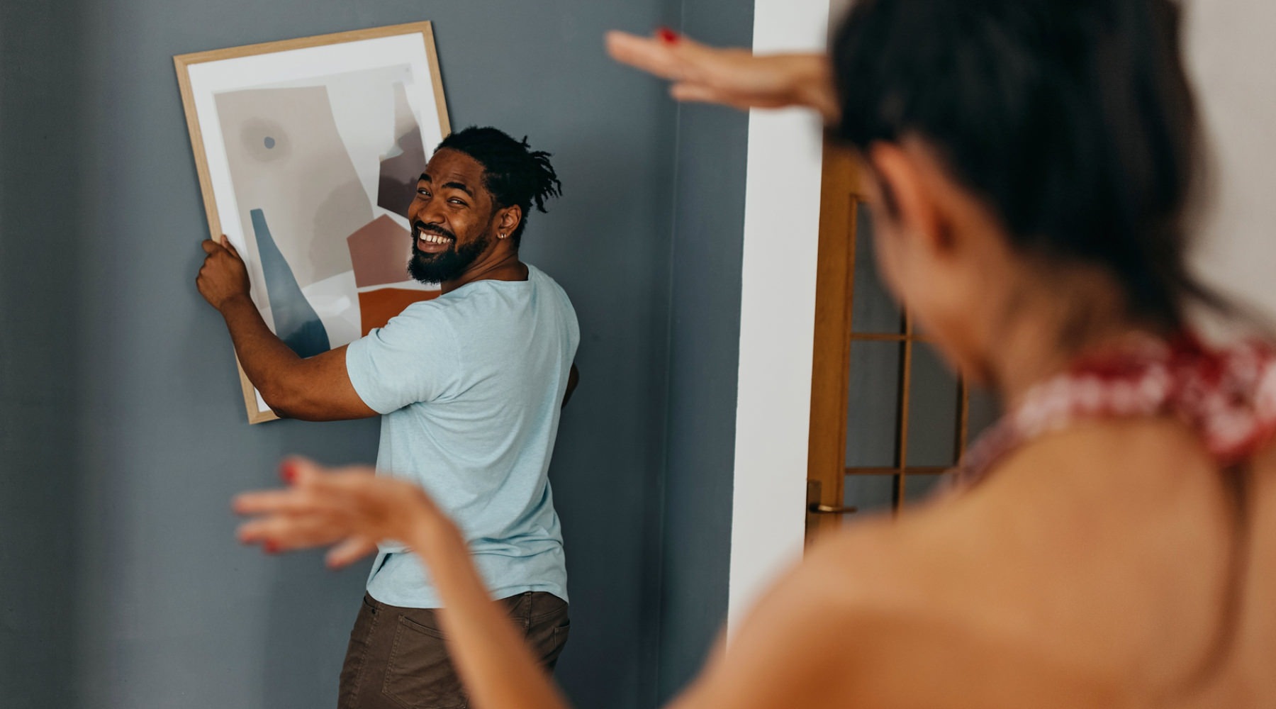 a couple handing pictures