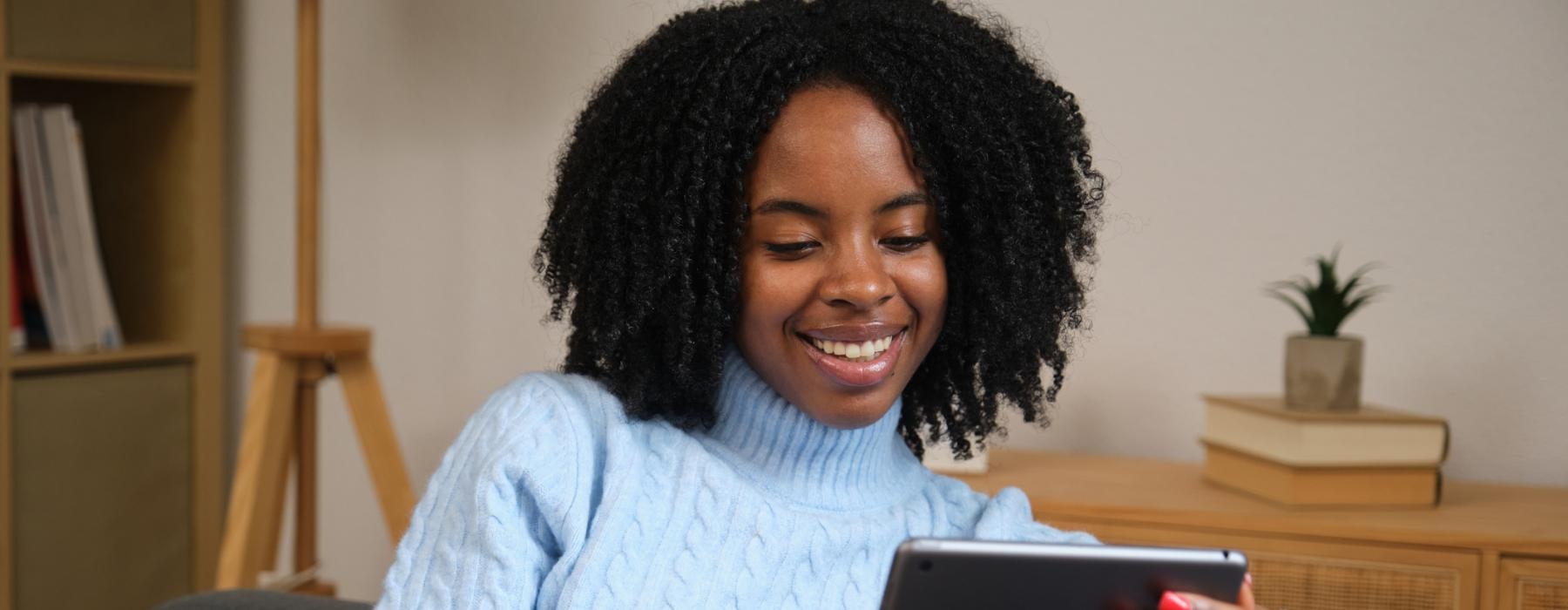 a woman holding a tablet