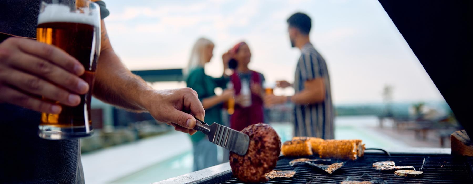 a person cooking food on a grill
