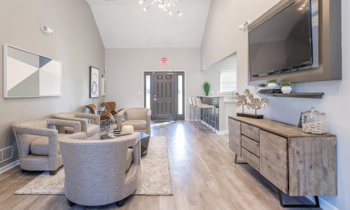 a spacious room with a tv and furniture