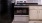 a kitchen with a stove and refrigerator